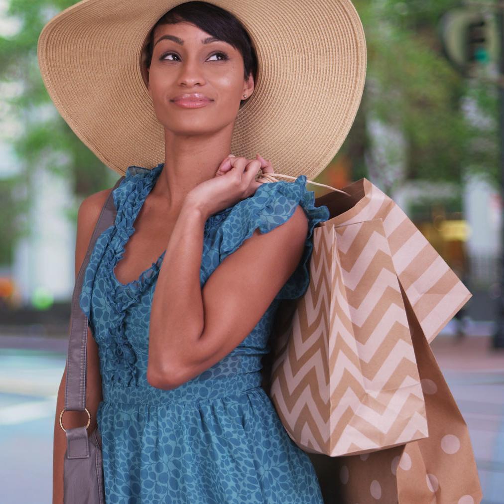 a young woman carries shopping bags in San Francisco's Union Square after applying for a personal loan to fund her needs